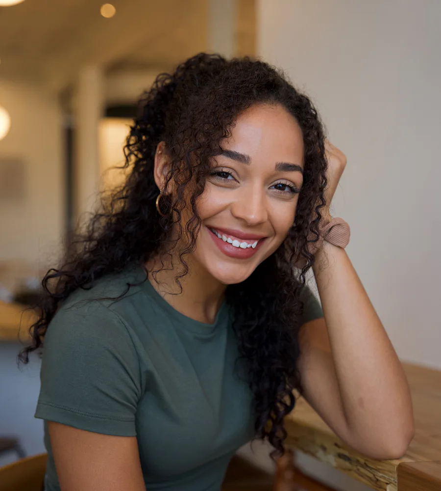 Woman with curly hair smiling